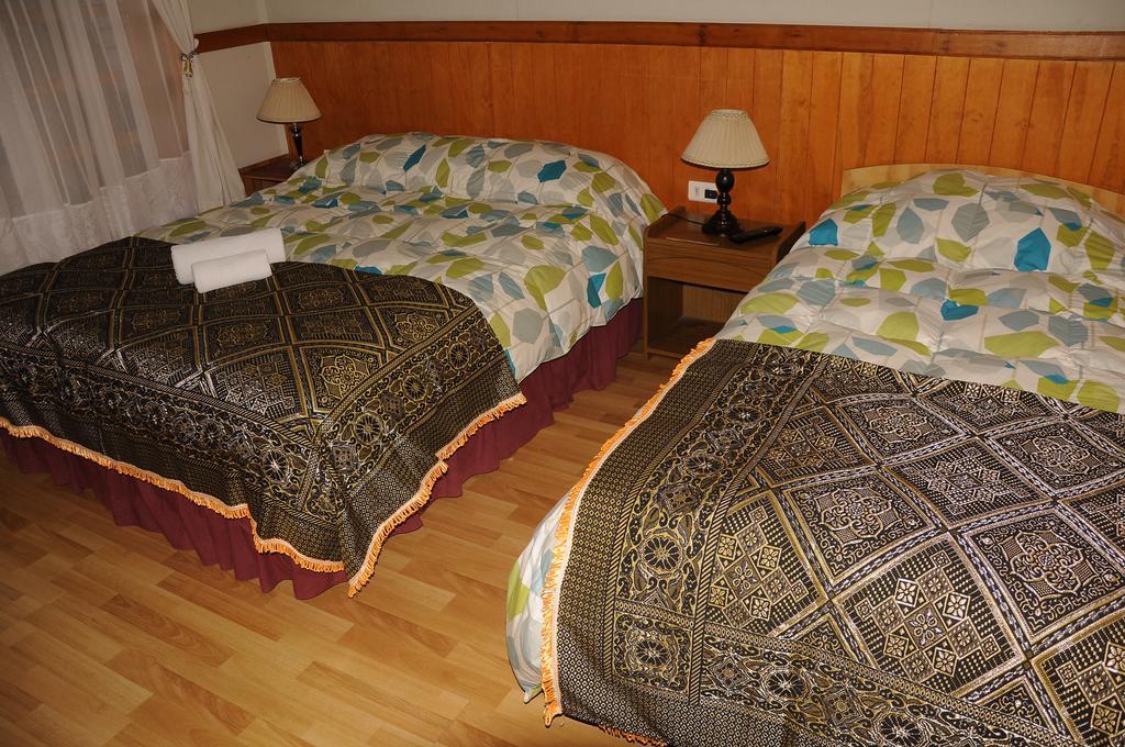Hostal El Rincón Puerto Natales Habitación foto